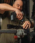 Man using Wrench AutoTorque Screwdriver with Digital Display, Integrated Torque Limiter, 15 Piece Bit Set, for Gunsmithing