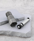 Hydraulic jack oil pump piston set components, silver color, shown on stone surface. Part of ✝️ 2 Sets of 2-20 Tons Hydraulic Jack Oil Pump Piston Set for Oil Pumps Pistons and Plungers replacement.