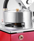 Close-up of a hydraulic pressure test pump component, showing the metal construction and connections on a 50 Bar hand pressure test pump.