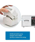 4 rotors 0-300ml/min high flow peristaltic pump with 24V stepper motor, shown with hand demonstrating tube replacement feature