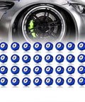 M6 Anodized Aluminum Washer Bolt Kit 32 Piece For Widebody Fenders And Dress Up shown against a car wheel.