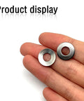 Hand holding M6 Conical Knurled 304 Stainless Spring Washer 14mm OD 1mm Thick Pack of 50
