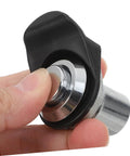 Push-close latch with black plastic knob and chrome metal body; close-up view