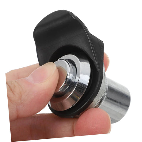 Push-close latch with black plastic knob and chrome metal body; close-up view