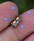 10Pcs DC 5V 2-Phase 4-Wire Micro Mini Ultra-Tiny 4 mm Precision Stepper Motor DIY on a fingertip with labeled wires.