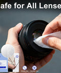 Person using Individually Wrapped Microfiber Lens Wipes For Glasses Sunglasses And Cameras to clean a camera lens.