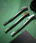 9 Pieces Mini Wire Brush Set Rust Paint Metal Cleaner Steel, Nylon, Brass Brush Set for Detail Cleaning shown on green fabric