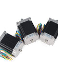 Three Nema23 Stepper Motors, 270 oz.in, 76mm, 1.8 deg, 3A, with 4 lead wires on a white background, dual shaft design