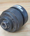 Nexen Group 801502 Air TL-A Torque Limiter with 0.875in bore, black metal construction, side view on wooden surface