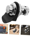 Push-button cabinet latch with round metal button and black housing for marine cabinets and boats