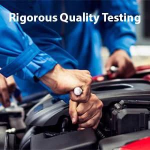 Mechanics performing rigorous quality testing under car hood with tools, showcasing automotive expertise and precision.