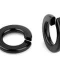 Two black 1/4-inch stainless steel split-lock washers shown in different orientations.