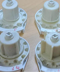 R Series with Bead Stopper (White, R8-1 1/4" Tube) clutches in different sizes on a wooden surface.