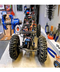 RC car with visible components in workshop, potential use for 35kg high Torque Coreless Motor servo Metal Gear Digital.