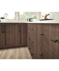 Riverside 8-13/16 Inch Center-To-Center Cabinet Pull In Honey Bronze Finish on kitchen cabinetry