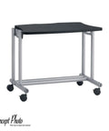 Compact rolling table with black top and silver frame on casters, ideal for mobility in small spaces, shown from a front angle.