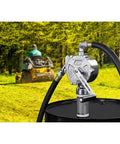 GPI - RP-10-UL Rotary Action Fluid Transfer Hand Pump, 10 Gallons per 100 Revolutions on a fuel drum in a grass field