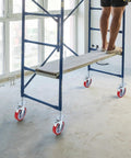 Four Pack 8 Inch Adjustable Leveling Scaffolding Wheels Scaffolding Caster Wheels With Brakes Swivel Locking Casters in use on construction site