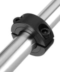 Shaft collar, double-split clamp-on steel with M4 screws; 13/16" bore, 1-5/8" OD, 1/2" thick (close-up).