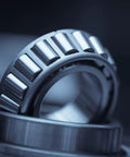 Close-up of Single Row Tapered Roller Bearing Cone and Cup Set for axial and radial load support in machinery.