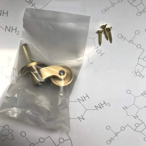 Solid Brass Caster Set With 25mm Wheels, 360 Degree Swivel, Screw Mount Fittings, in packaging with screws on the side