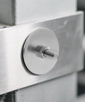 Installed stainless steel 1/4 in ID x 2 in OD fender washer with bolt and hex nut on metal frame