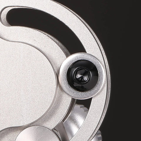 Close-up of Five Sixteenth By Eighteen Threads Per Inch Button Head Socket Cap Screw in stainless steel showing black hex drive