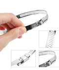 Stainless Steel 6 Inch Duct Hose Clamp Adjustable Diameter 140 To 160mm Worm Drive Clamp in hand, close-up view.