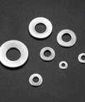 Conical Knurled Spring Washers Set, Stainless Steel, Coned Disc, M3-M12, various sizes displayed on black background.