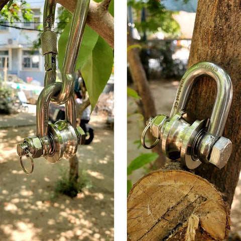 Close-up of Long Unbuckled U Shaped Swivelling Pulley Stainless Steel Duplex Bearing, attached to outdoor setup for lifting.