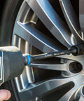 1/2 in. Drive 100 ft. lbs. Torque Limiting Extension Bar attached to impact wrench adjusting car wheel lug nut