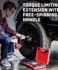 Mechanic using 8 Piece Torque Limiting Extension Bar and Socket Set with Free-Spinning Grip Handles on car wheel, red case nearby