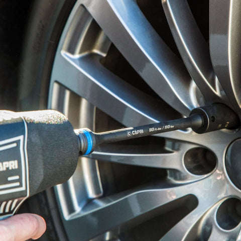 Torque Limiting Extension Bar Set (5 Piece), 65-140 ft. lbs., 1/2 in. Drive being used on car wheel with impact wrench