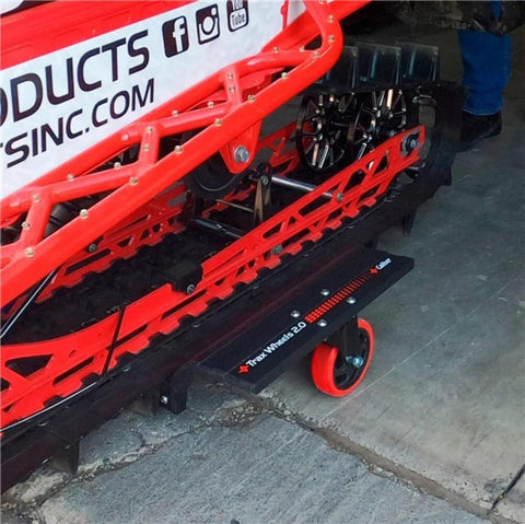 Trax Wheels 2.0 Rear Wheel Casters for snowmobiles and snow bikes installed beneath a snowmobile track, 29x16 inch castor