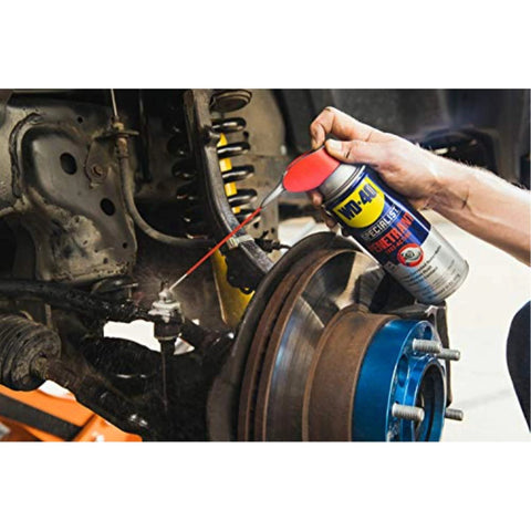 Applying WD-40 Specialist Penetrant with Smart Straw on metal and rubber vehicle components.