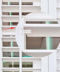Close-up of white plantation shutter with 40 Pieces Shutter Repair Pins, Plantation Shutter Fasteners Spring Loaded Replacement Repair Pins for windows.