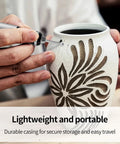 Person using Wireless Engraving Pen Kit With 30 Metal Grinding Bits Ceramic Bit And 3 Cutting Blades on ceramic vase